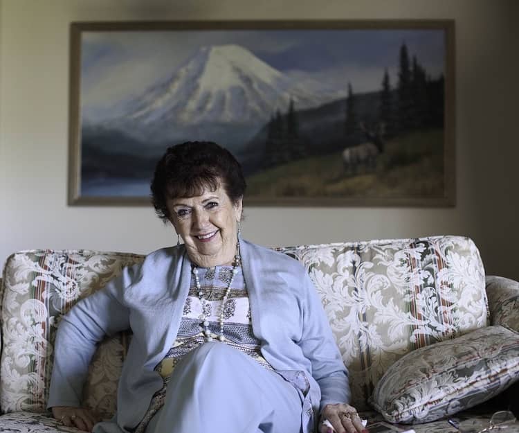 Photo of Shirley Rosen sitting on couch.